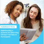 Title of article with image or two women sharing information in a medical setting. Title is: Installment Three Implementing a Solution for Returning Clinical Trial Data to Participants